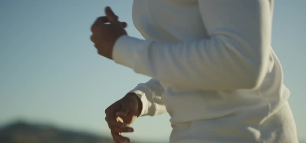 A woman jumping outside
