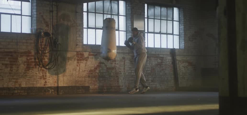 A man punching a punching bag