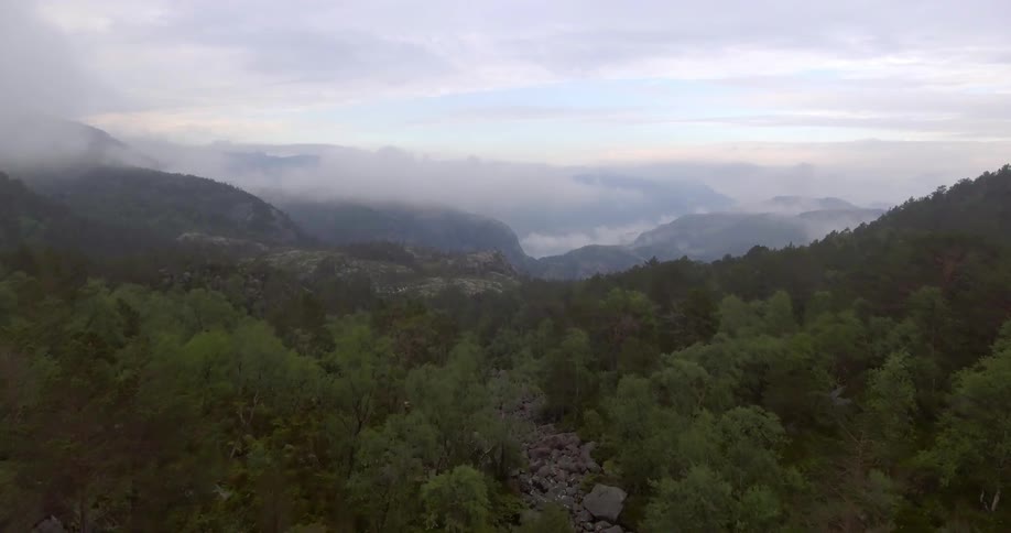 Mountains partially covered by low lying clouds