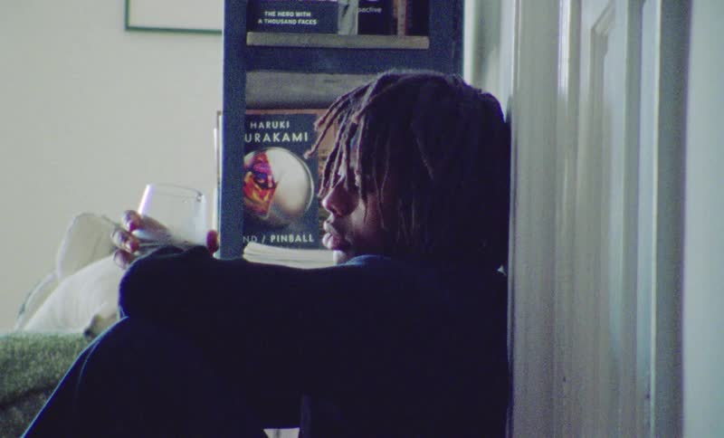 Black male drinking water