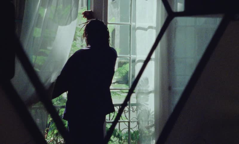 A person walks up to the window
