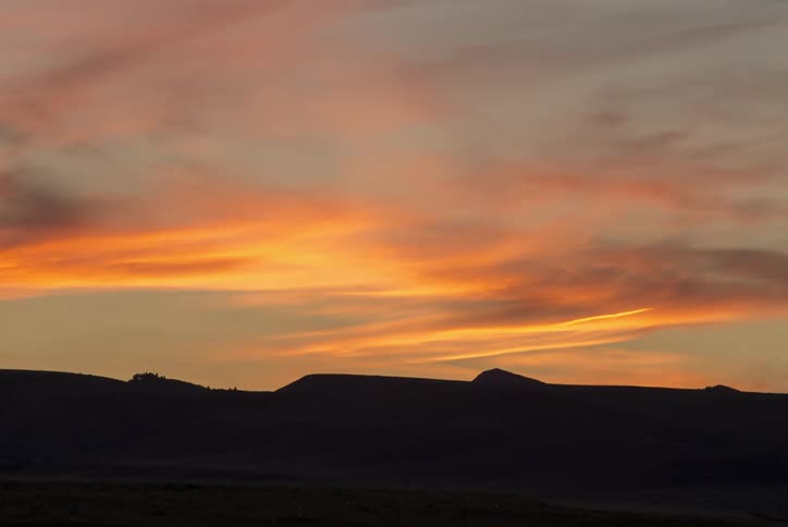 The sun is setting in the horizon