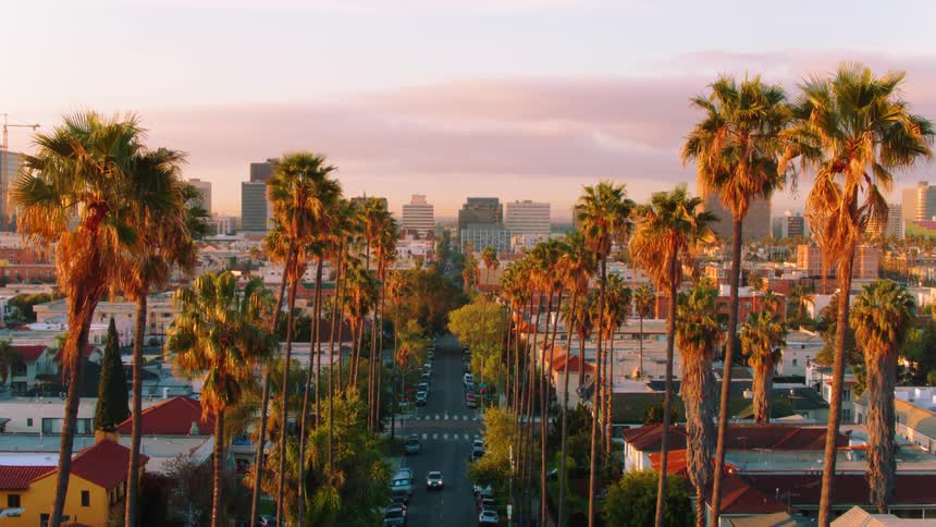 The sun is rising in downtown Los Angeles