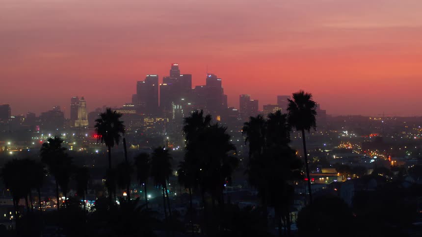 The sky is red at sunset over the city