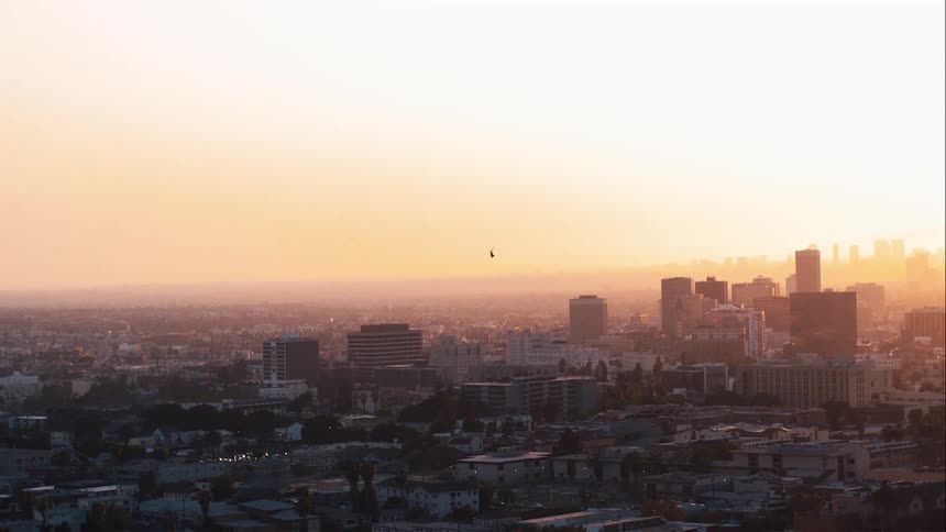 A helicopter flying over a city