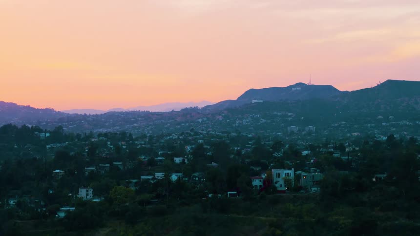 Dozens of homes sit below and along the slope of a wide mountain range