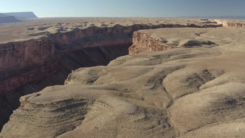 River canyon crag escarpment with mesa on the horizon