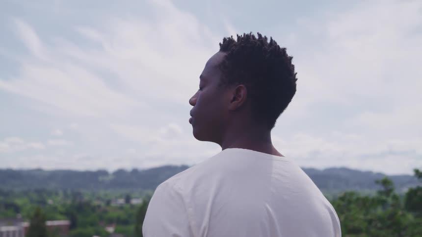 A man standing and looking into the distance