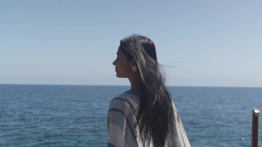 A woman looking out into the ocean