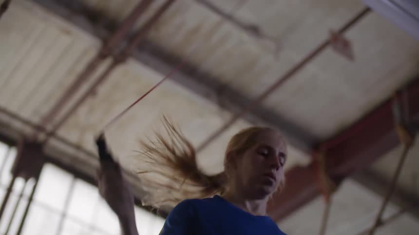 Woman jumping up and down with a jumping rope