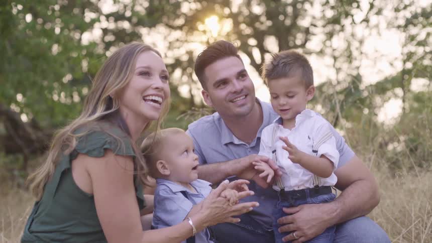 A family sitting and clapping