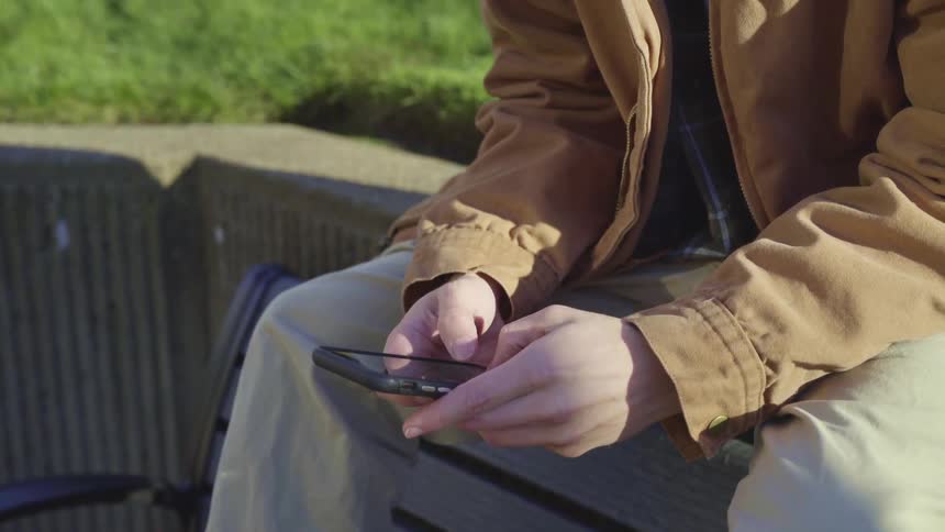 Man typing on phone