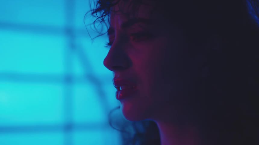 A woman is scared in the dark room