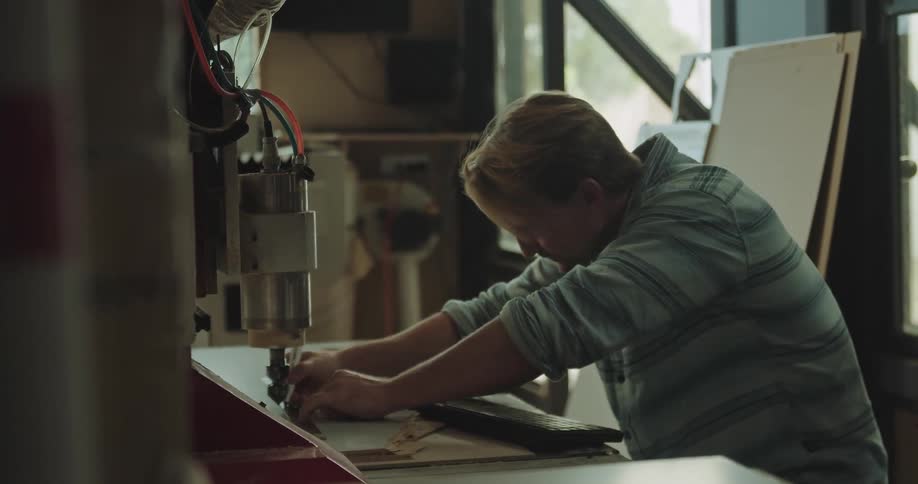 A man preparing his cnc mill