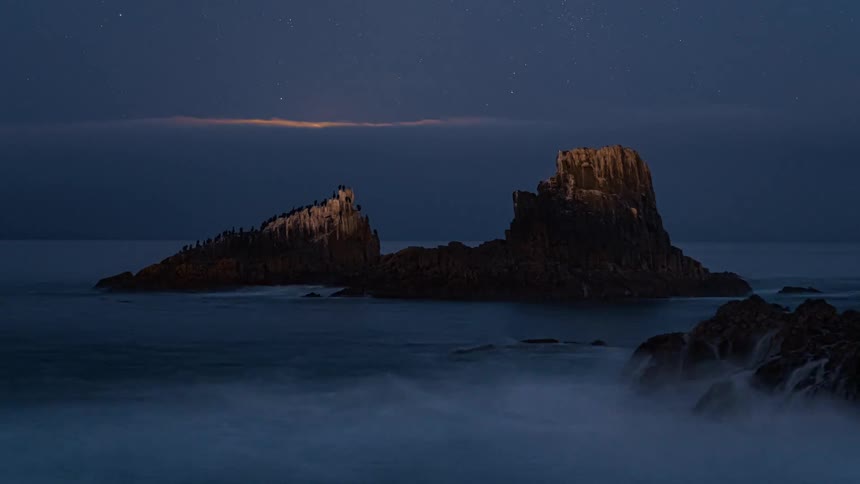 Sped up coastal scene of the moon and ocean current