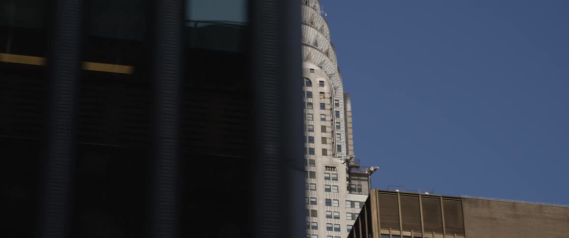 Downtown buildings and windows against a blue sky