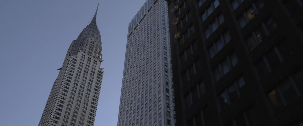 Buildings in a downtown area against a blue sky