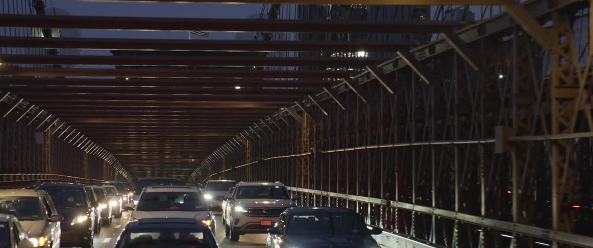 Traffic driving on a bridge in a city