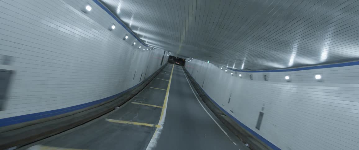 A highway is displayed in a tunnel