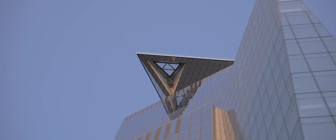 Tall modern skyscraper in the citys downtown at day time