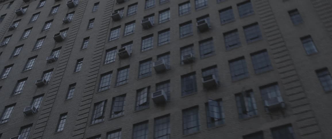 A high rise apartment building in a downtown area