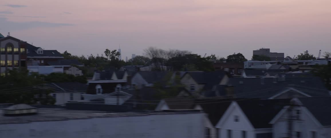 Houses and buildings in a city at dawn