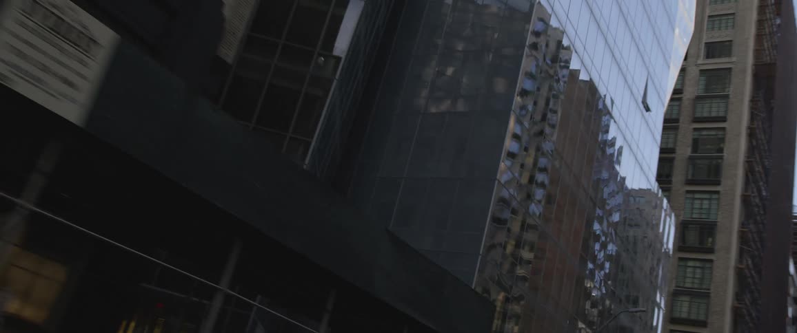 Tall skyscrapers lining a city street in the daytime