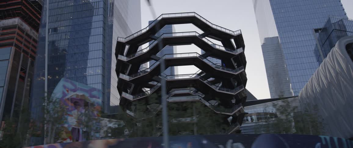 A sculpture in front of office buildings in downtown area