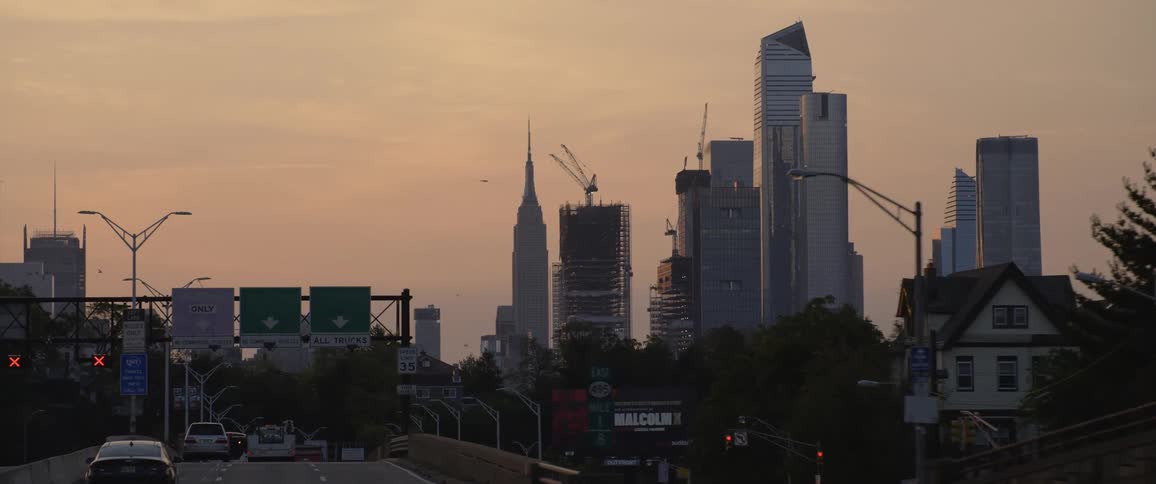 Wide shot of downtown skyline at dusk
