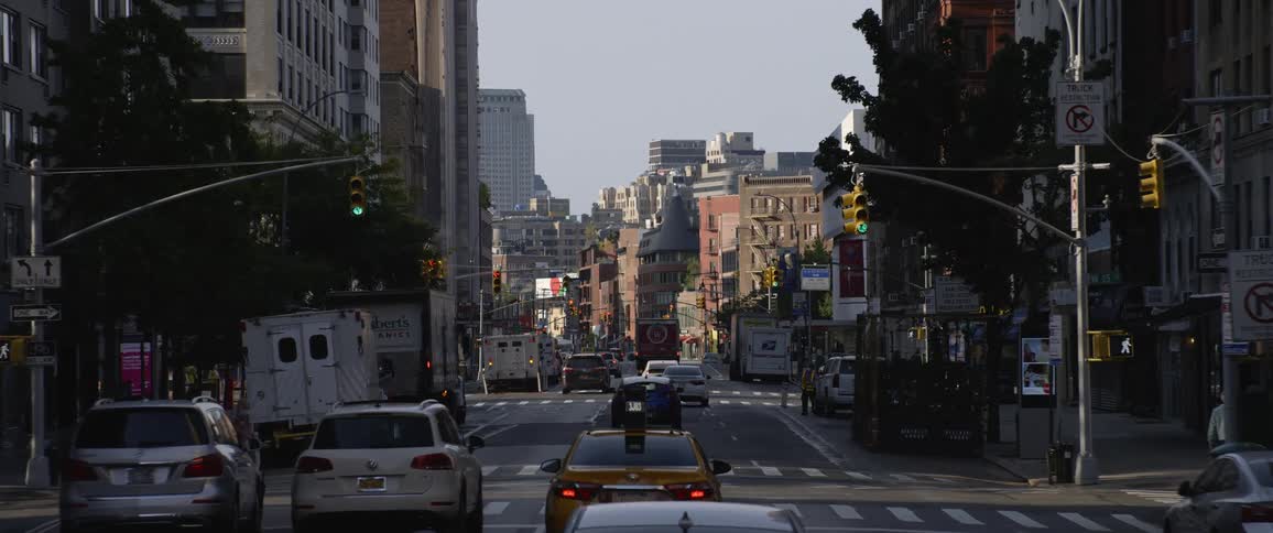 Cars and people on a busy city street