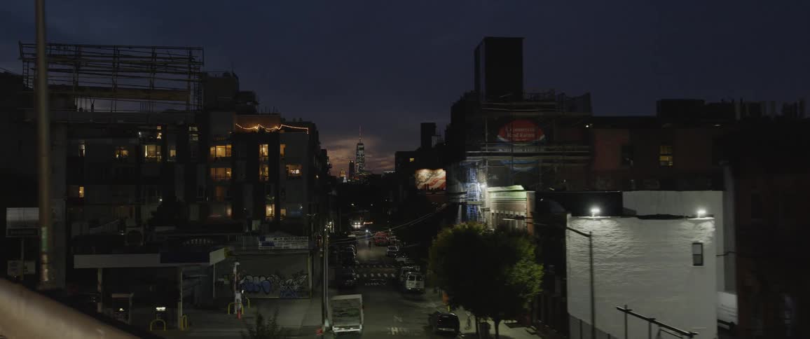 City streets at night time with buildings and signage