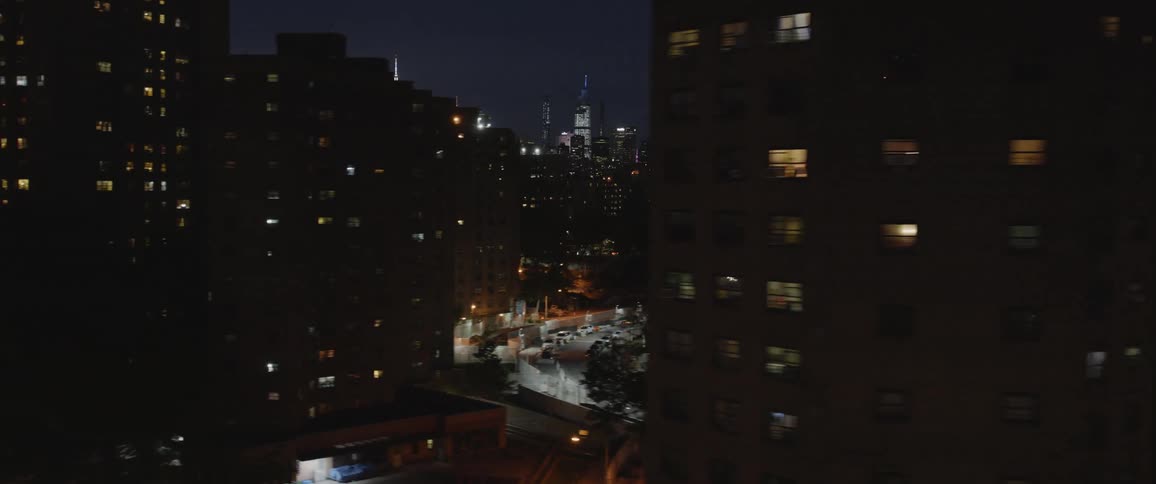 Buildings are displayed in a city at night