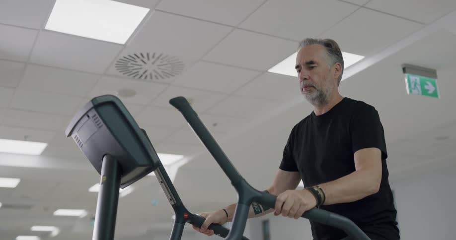 A man walking on a stepper