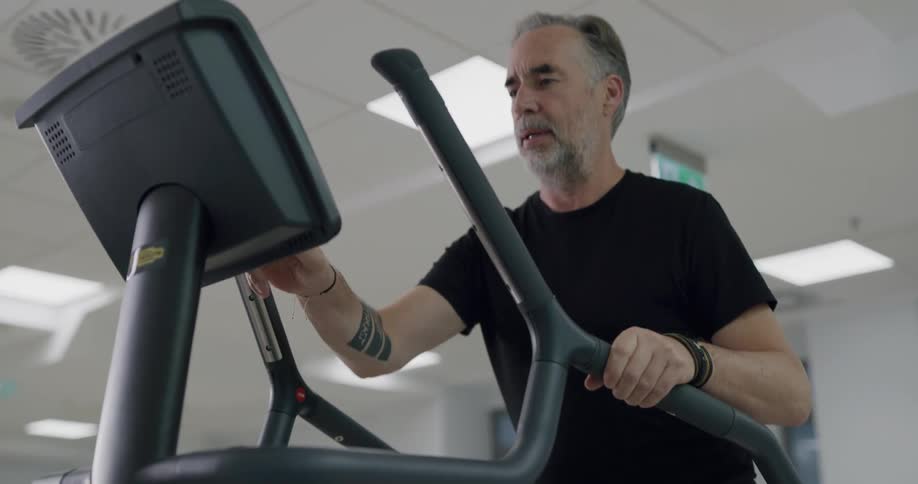 A man is exercising in the gym