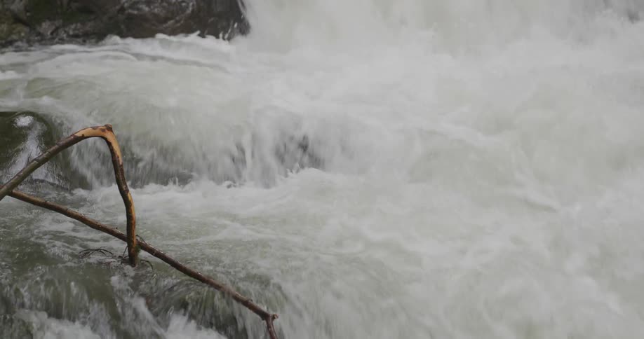 Rapid waterfall water flowing and splashing