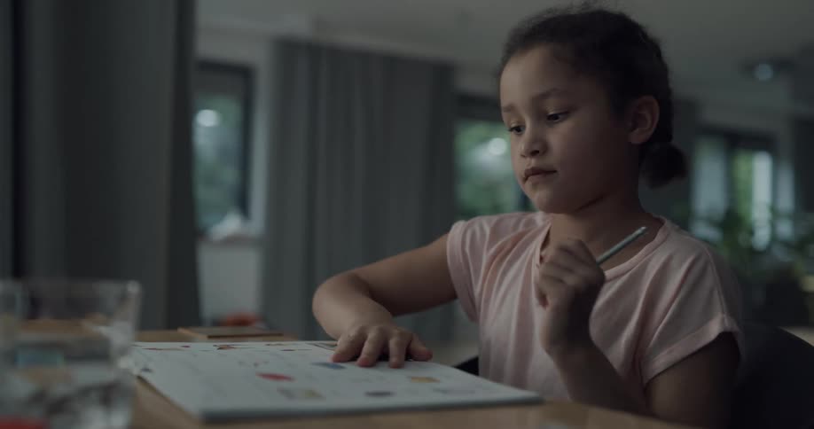 A child writing in a notebook