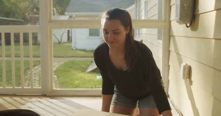 A woman opening a box