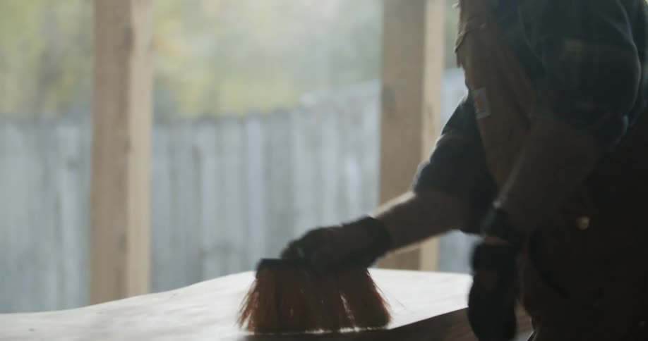 A man working on a piece of wood
