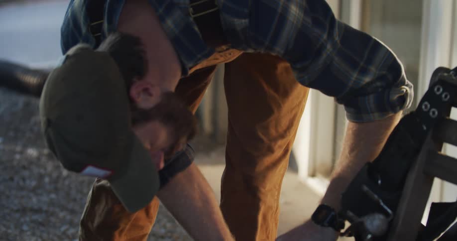 A woodworker taking measurements