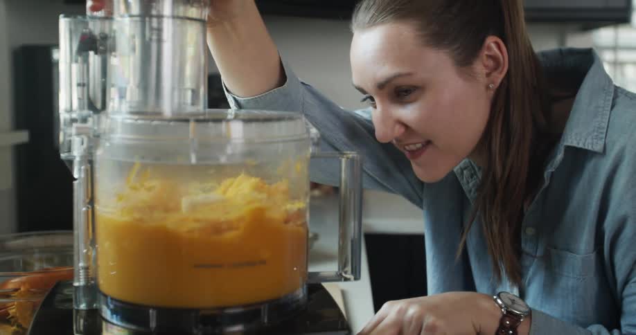 A woman processing food