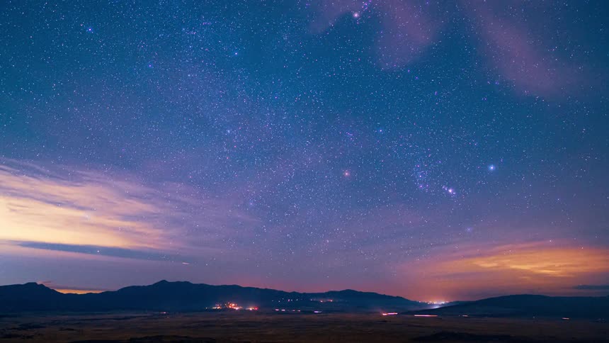 Time lapse of the stars rising over a road on a clear night