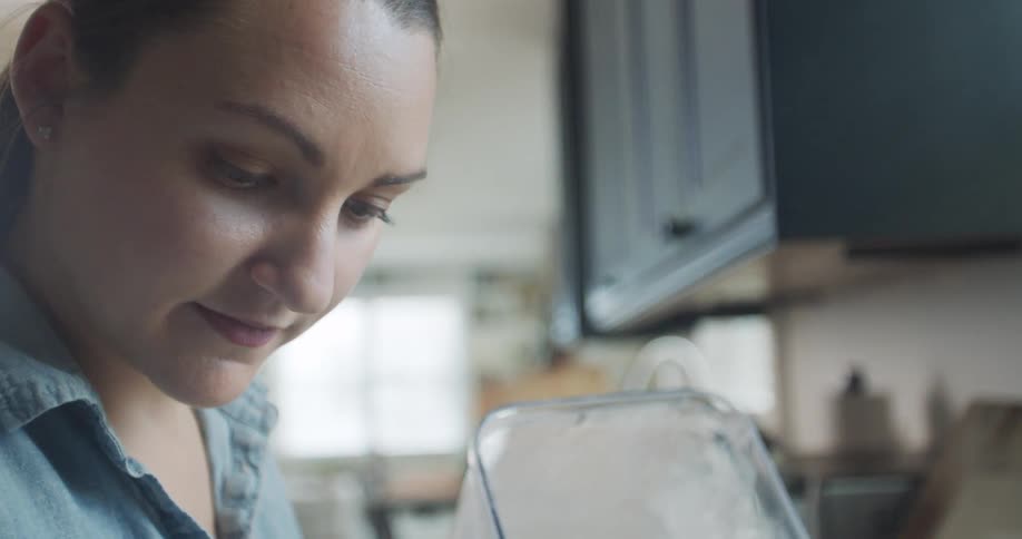 A woman cooking in a kitchen