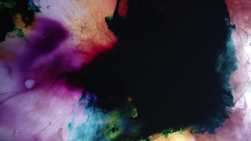 Ink blob expanding and diffusing in a medium surrounded by multicolored inkblobs