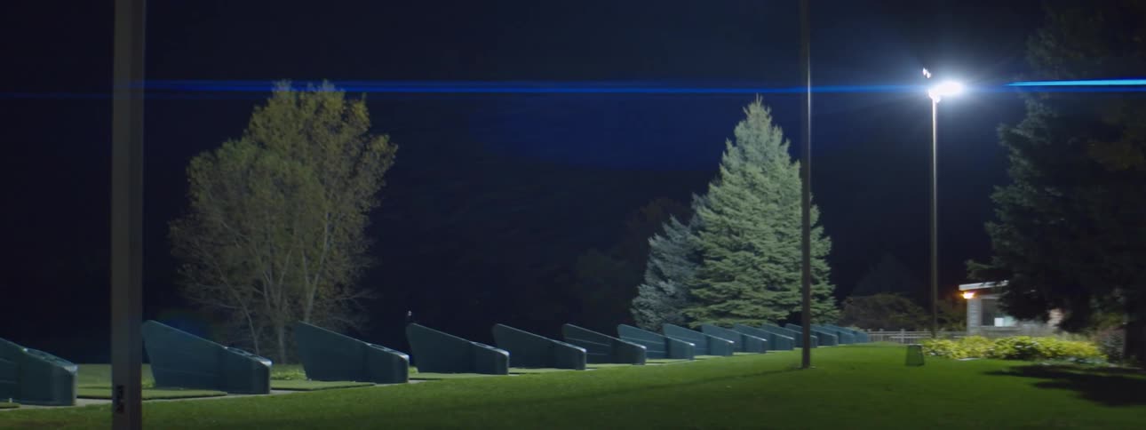 Stalls at the golf driving range at night