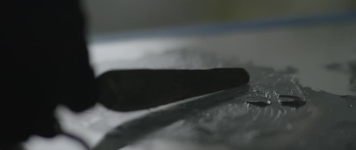 A person is mixing some paint