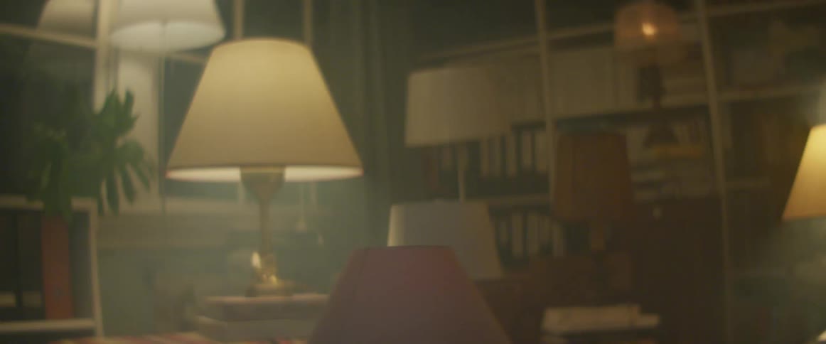 A roomful of lamps in a house flashing on and off rapidly