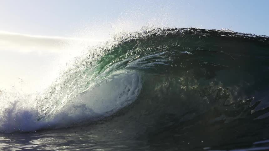A large wave moving in the ocean