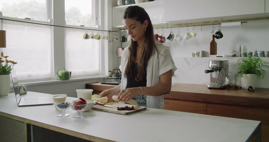 Woman cutting fruit