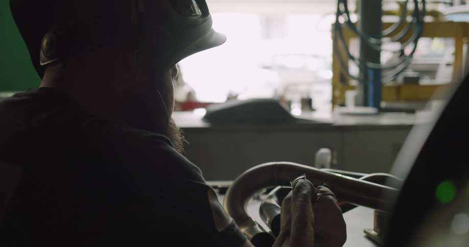 A machinist working with tools