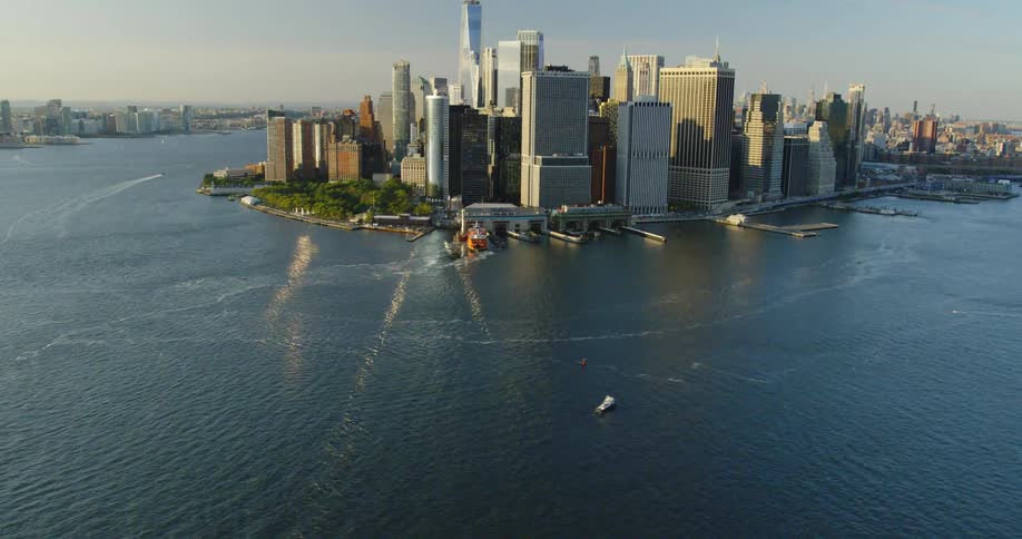 Aerial view of a city against water with boats and docks